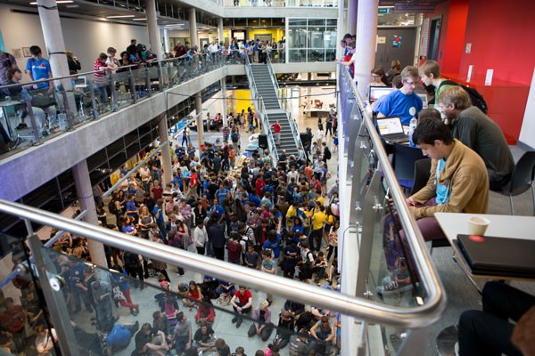 YRS - hundreds of young people in a large space with computers