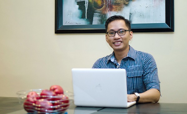 Web developer Andrew Garcia with his laptop