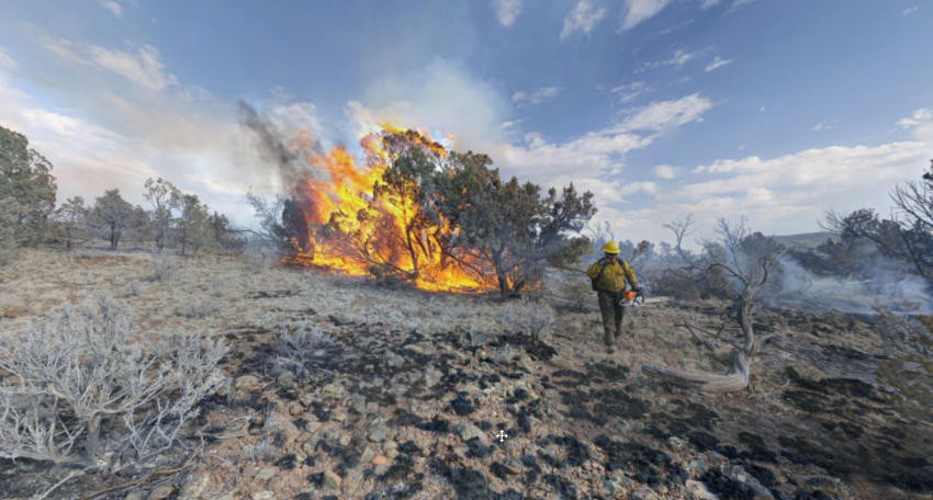 Firefighters battle forest fire in desert conditions